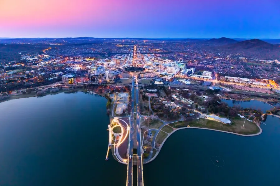 Aerial view of Canberra city and Lake Burley Griffin at dusk